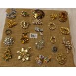 PAD OF COSTUME BROOCHES