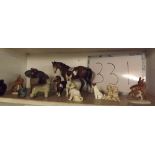 A SHELF OF CHINA ANIMALS