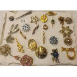 PAD OF COSTUME BROOCHES