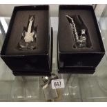 TWO BOXED CRYSTAL CLEAR COLLECTABLE'S, GLASS & METAL GUITAR & A WHITE METAL AND GLASS SAXAPHONE