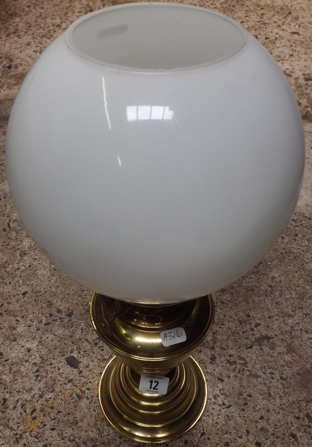 BRASS OIL LAMP WITH GLOBE SHAPE SHADE