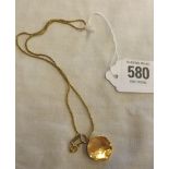 A 15ct GOLD HINGED LOCKET ON GILT CHAIN