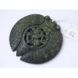 Large oriental carved green stone circular pendant