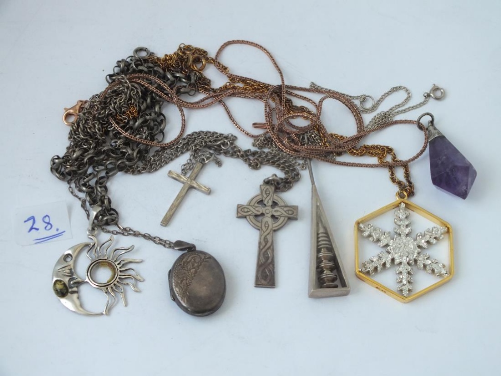 Seven silver pendants on chains