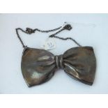 Large silver necklace in the form of a bow tie