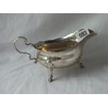 George III style heavy sauce boat with leaf capped double scroll handle - 7.5" wide - London