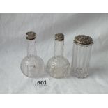 Pair of bottle shaped jars with screw on silver covers - marked Sterling