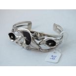 Silver torque bangle adorn with lilys