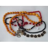 Amber coloured bead necklace & other assorted necklaces