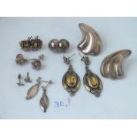 Seven pairs of silver earrings