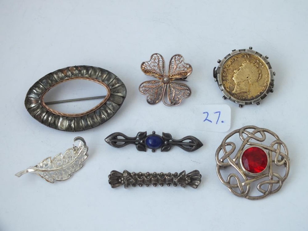 Seven assorted silver brooches