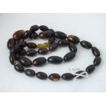 String of rare oval amber beads - 48.9gms