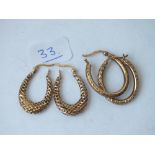 Two pairs fancy oval hoop earrings in 9ct - 3.3gms