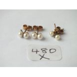 Two pairs of 9ct pearl set ear studs