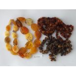 A large bag of assorted amber necklaces etc.