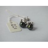 Pair of 18ct green pearl earrings - 5gms