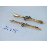 Two 9ct triple stone bar brooches - 2.7gms