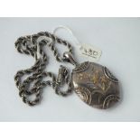 Victorian oval silver locket overlaid in 2 colour gold on later rope twist chain