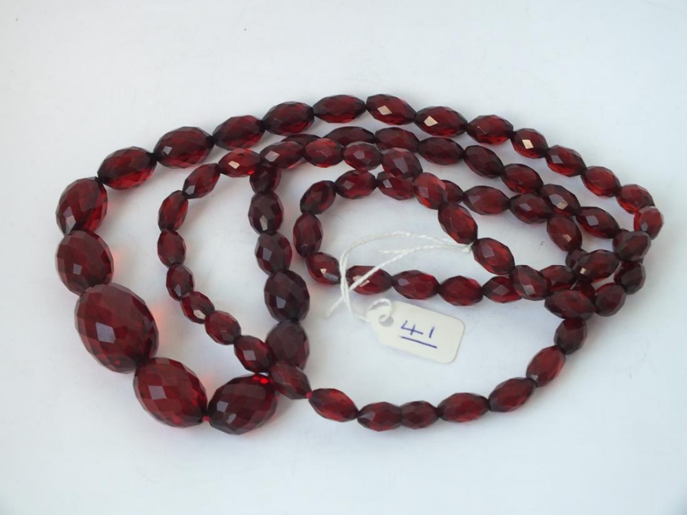 Long string of graduated cherry amber beads