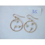 A pair of pearl mounted hoop earrings in 9ct