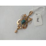 Art Nouveau rose gold pendant in a scroll design with central turquoise matrix & suspending a rose