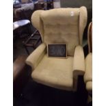 A GOOD QUALITY CREAM PATTERNED WING BACK ARMCHAIR