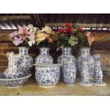 SHELF CONTAINING FOUR LARGE BLUE & WHITE VASES WITH ARTIFICIAL FLOWERS, PLUS SIX OTHER PIECES OF