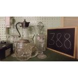 SHELF OF TWO CLARET JUGS, CUT GLASS DECANTER & OTHER GLASSWARE