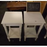 A PAIR OF WHITE PAINTED CARVED PLANT STANDS WITH SHELVES