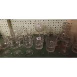 SHELF OF CUT GLASS TUMBLERS & WINE GLASSES