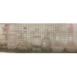 SHELF OF VARIOUS DECANTERS