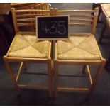 A PAIR OF STRUNG SEATER BAR STOOLS