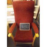 A GOOD QUALITY HIGH BACKED UPHOLSTERED ARMCHAIR