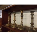 FOUR SHEFFIELD PLATE EXTENDING CANDLESTICKS (OBVIOUS SILVER LOSS)