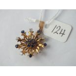 Attractive diamond and sapphire sunburst pendant in 18ct gold