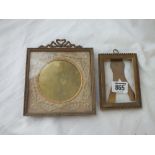 Two smaller brass picture frames