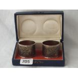 Pair of middle Eastern Niello decorated napkin rings in fitted case -