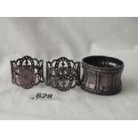 Pair of pierced and bright cut napkin rings - London 1894 and another (French)