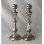 Pair of circular candle sticks with scroll decorated bands - 10.5" high