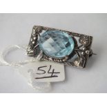 Antique silver brooch set with large faceted blue stone