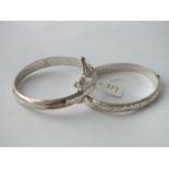 Two good chased silver bangles