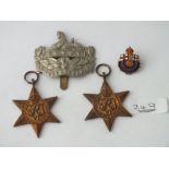 Four silver military badges