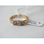 Three stone dress ring in 9ct - size M - 2.6gms