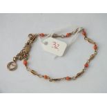 Coral bead link bracelet set in 9ct - 4.9gms