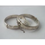 Two good chased silver bangles