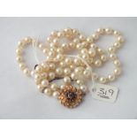 Pearl necklace with fancy 9ct garnet clasp