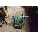 GREEN HOSE REEL ON TROLLEY