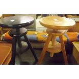 TWO ADJUSTABLE WOODEN THREE LEGGED STOOLS