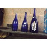 3 GRADUATED BLUE GLASS BOTTLES