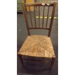 OLD CARVED CHAIR WITH STRUNG SEAT